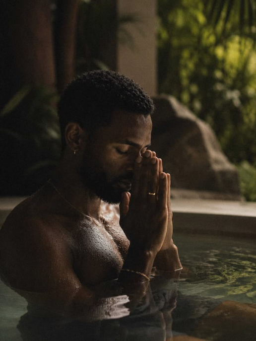 Man meditating peacefully in water
